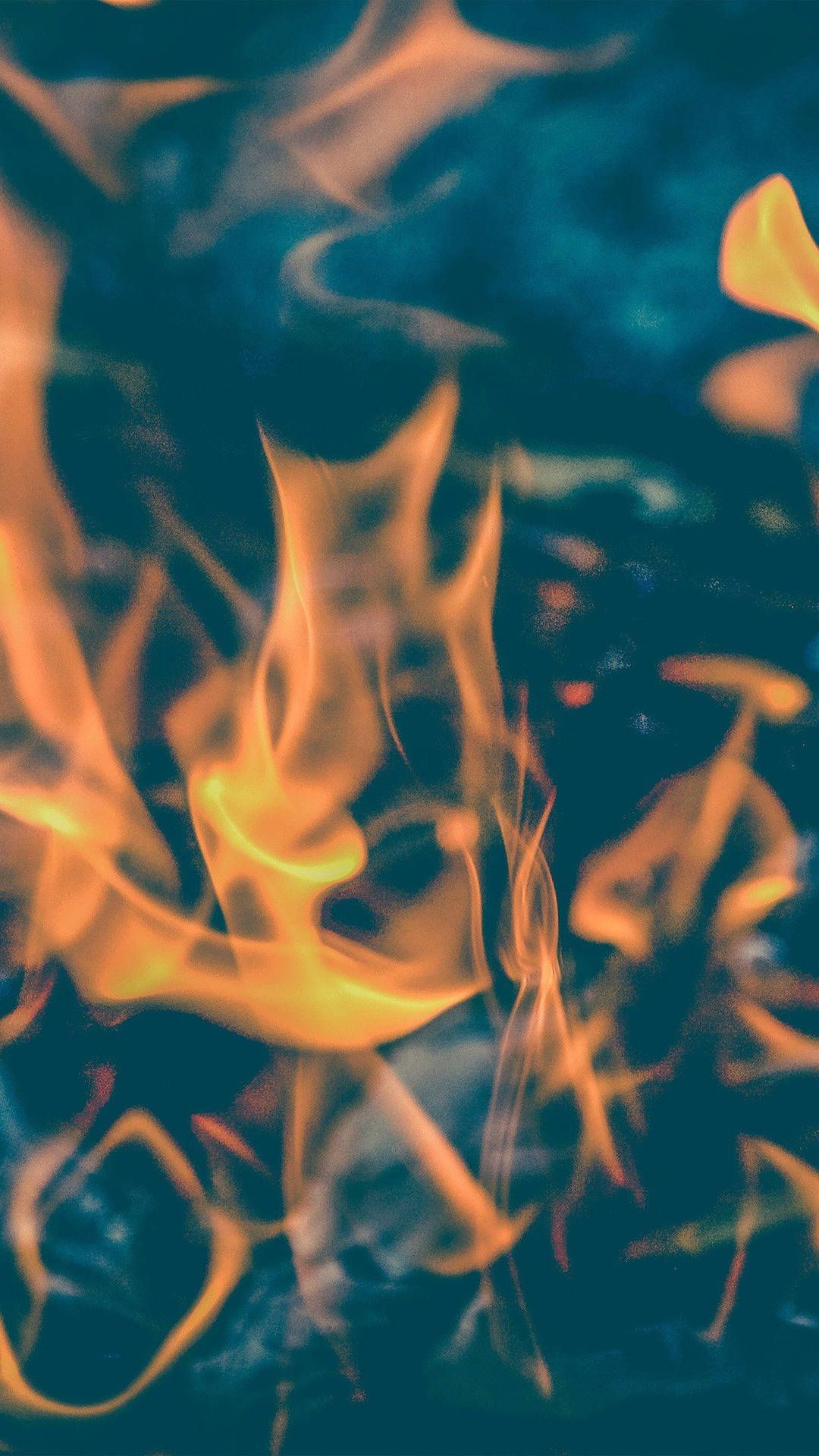 "Amber flames dance in the night sky". Wallpaper