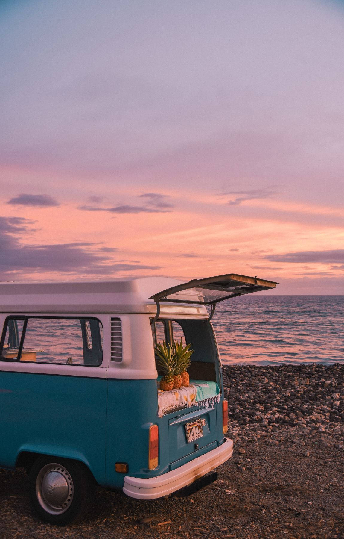 Camping Van With Pineapple On Purple Beach Sunrise Wallpaper