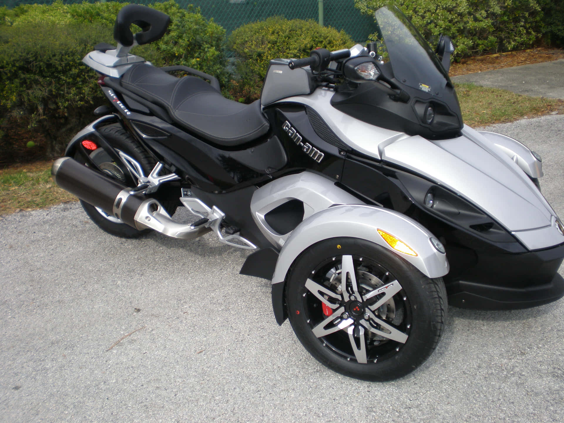 Can Am Spyder Motorcycle Parked Outdoors Wallpaper