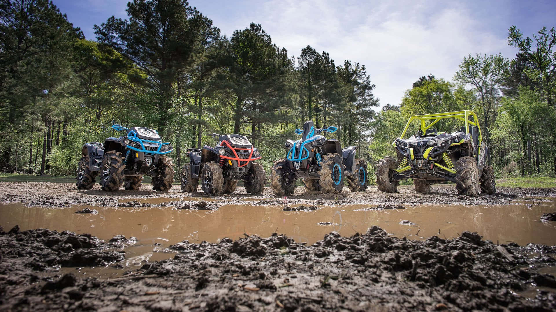 Unleashing the Power - Can-Am X MR Mud Lineup ATV  in Action Wallpaper