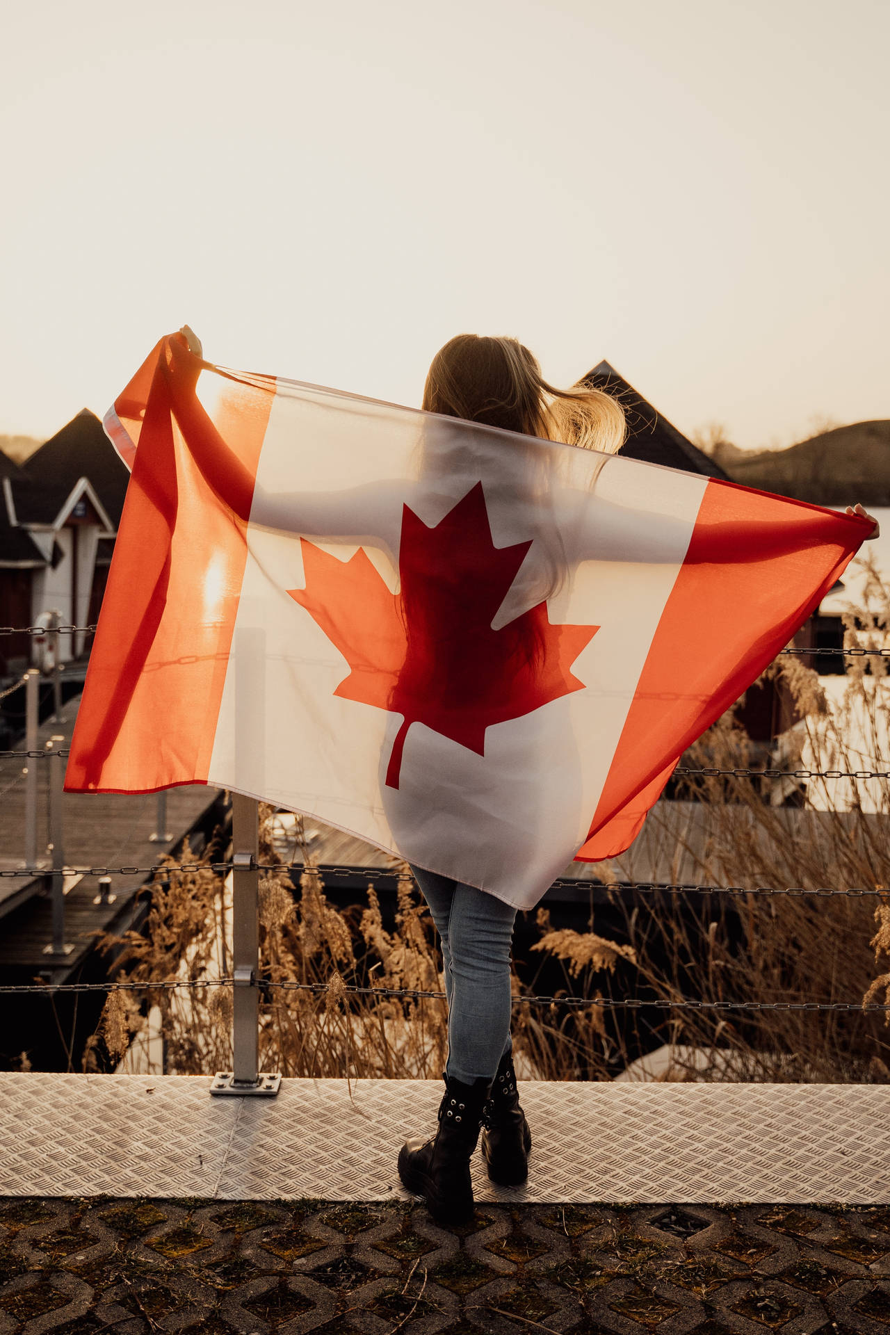 Proud Canadian Woman holding National Flag Wallpaper