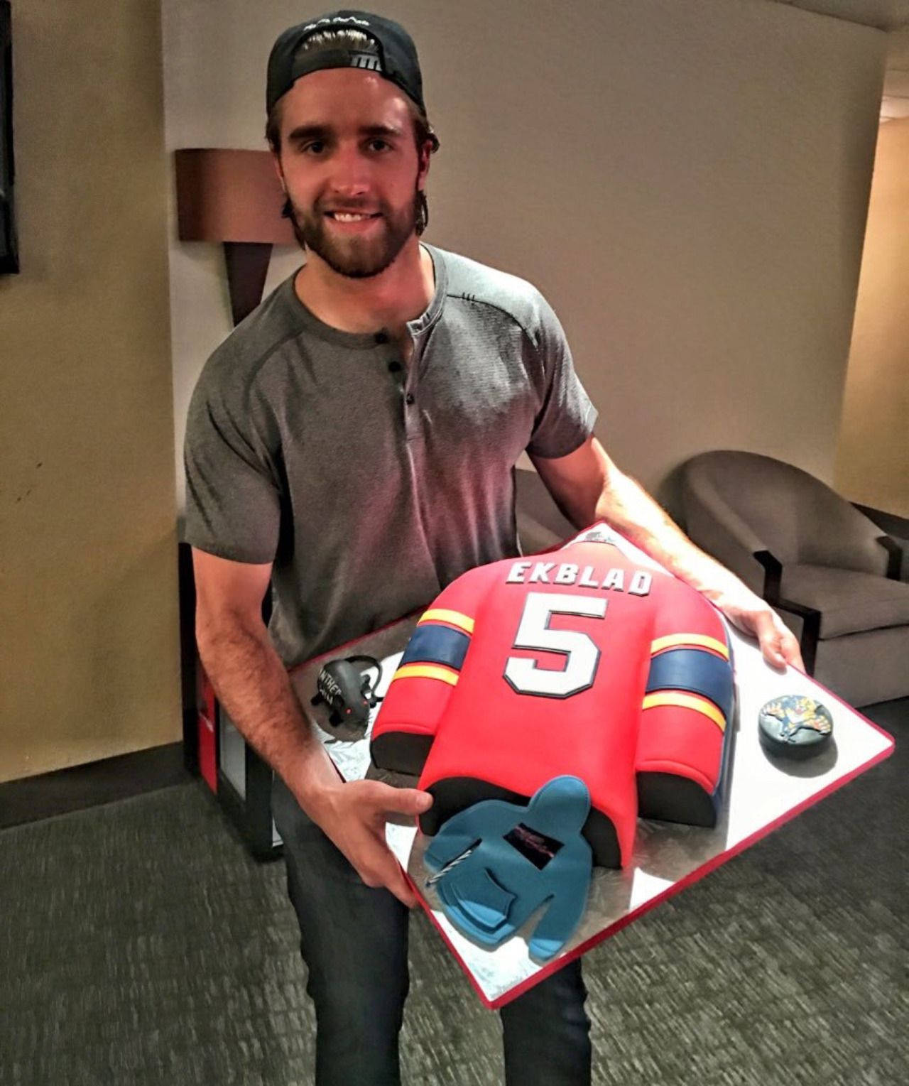 Canadian Ice Hockey Player Aaron Ekblad Holding Cake Portrait Wallpaper