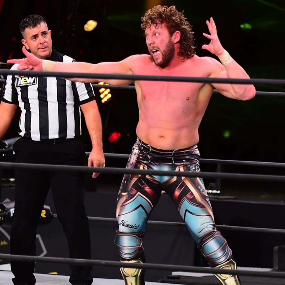 Canadian Professional Wrestler Kenny Omega With Referee Pose Wallpaper
