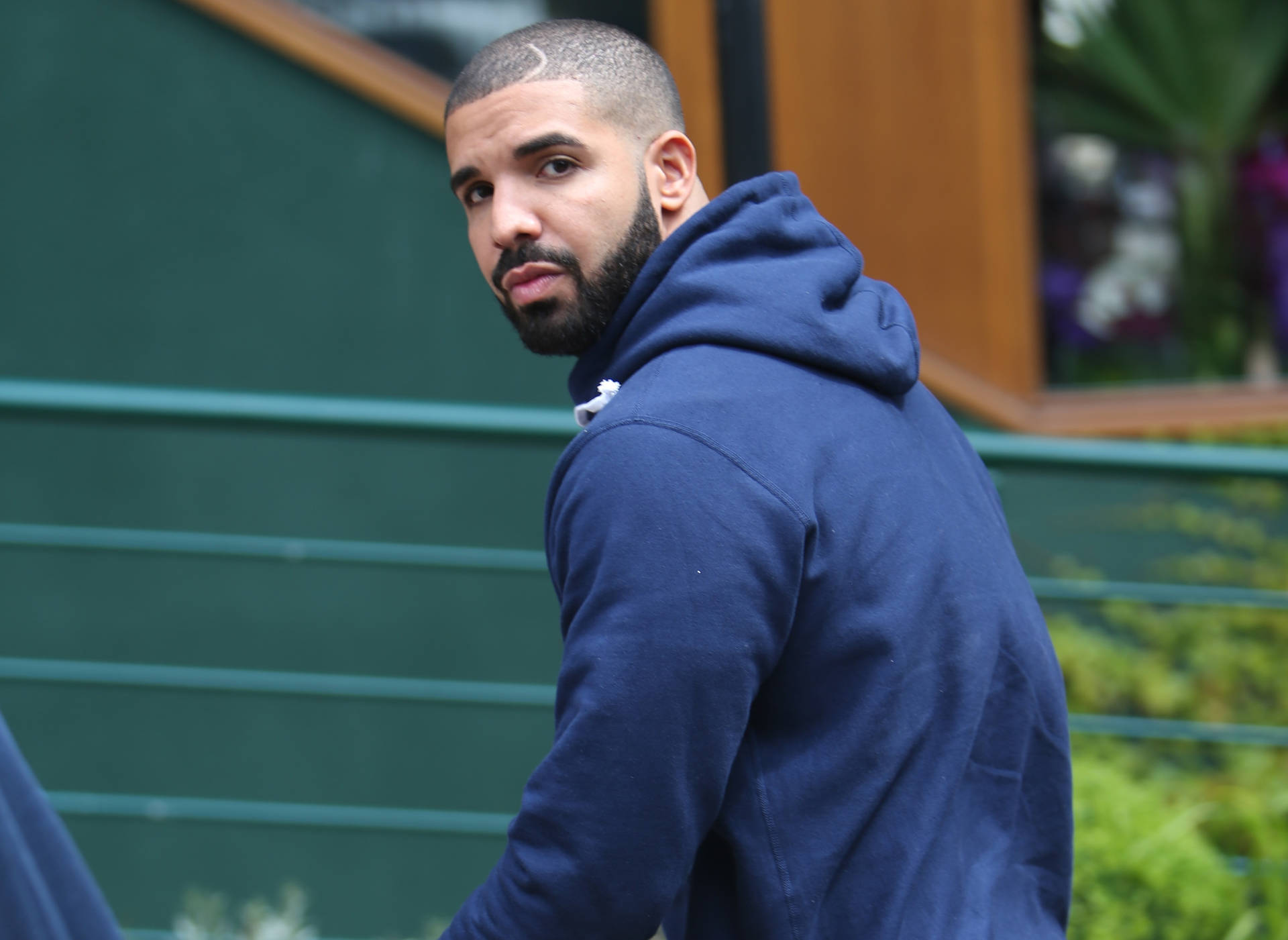 Canadian Rapper Drake In Hoodie Background