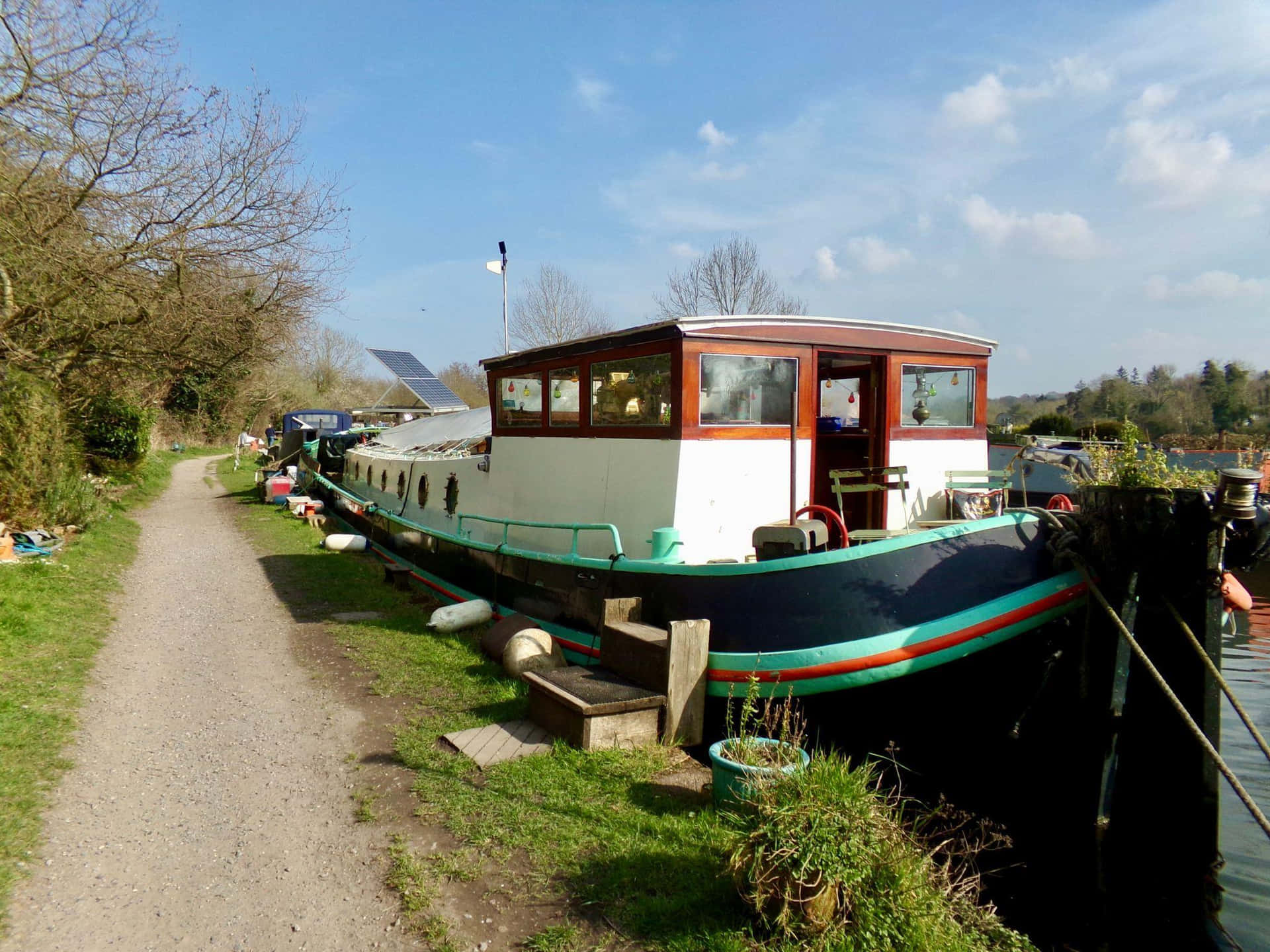 Canal Boat Moored Along Pathway Wallpaper