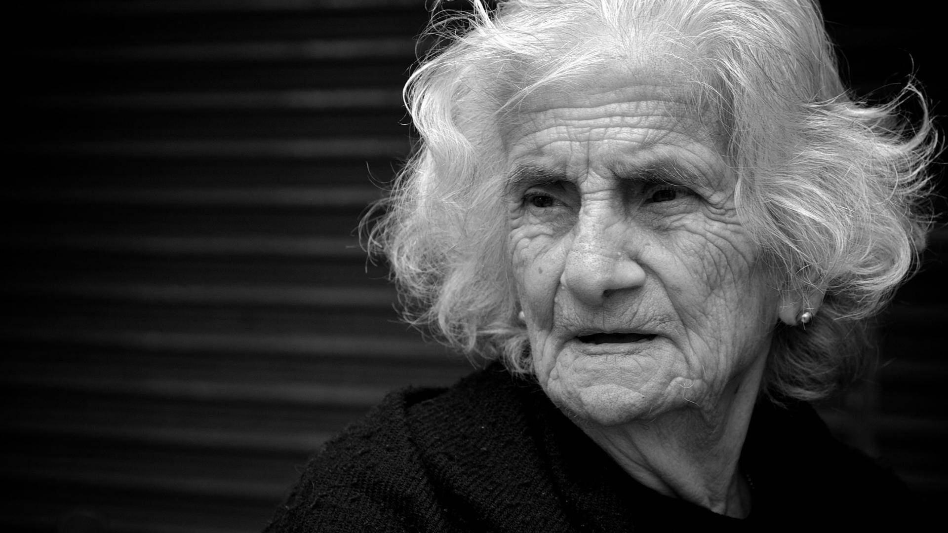 Candid Portrait Of An Old Woman Wallpaper