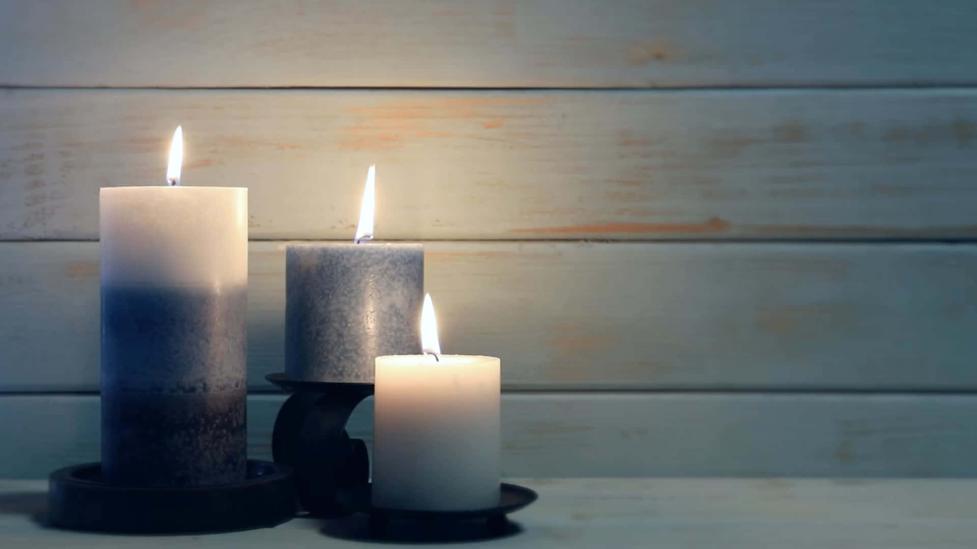 Three Candles On A Wooden Table
