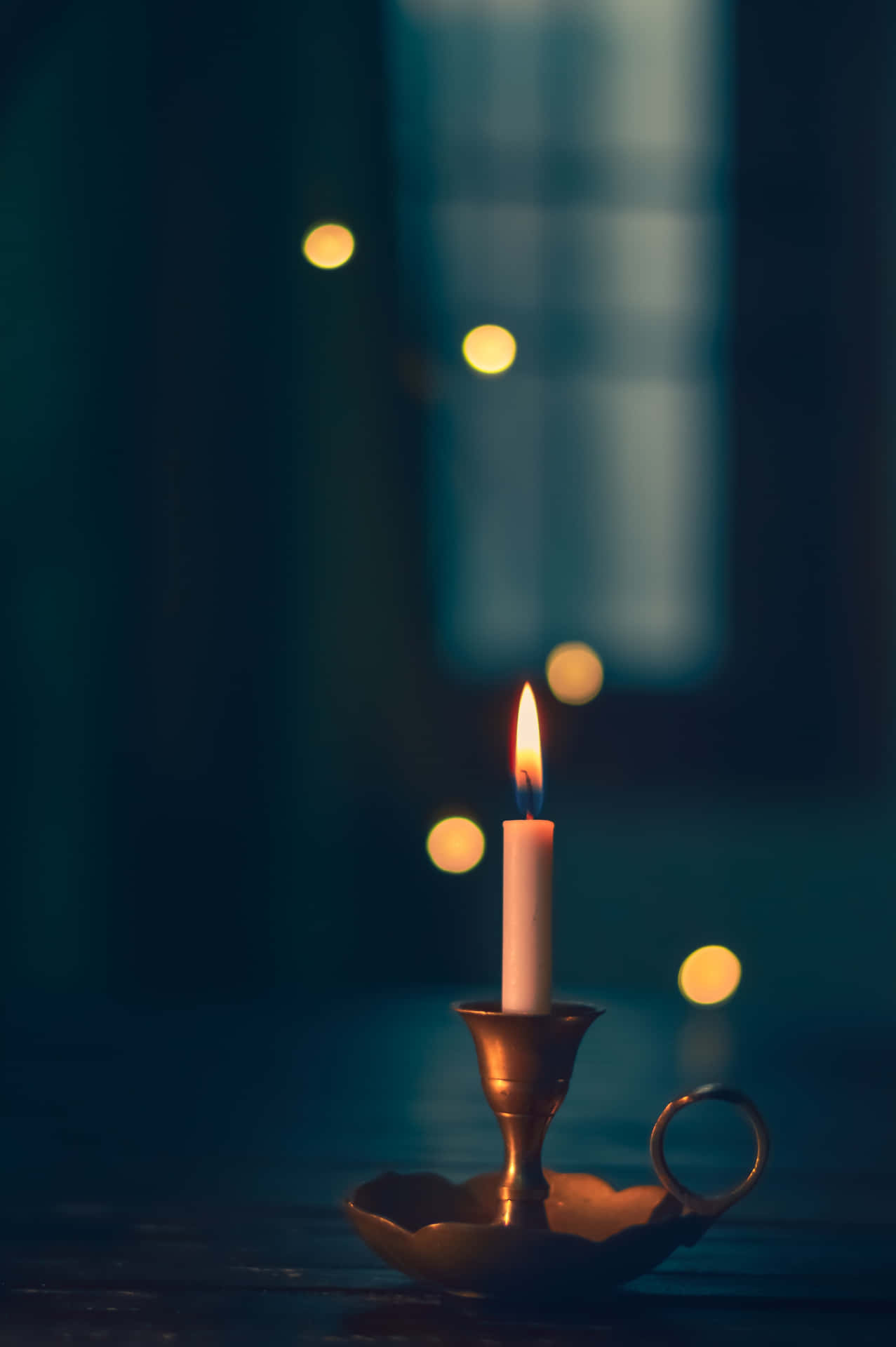 Feel the warmth of light with a burning candle.