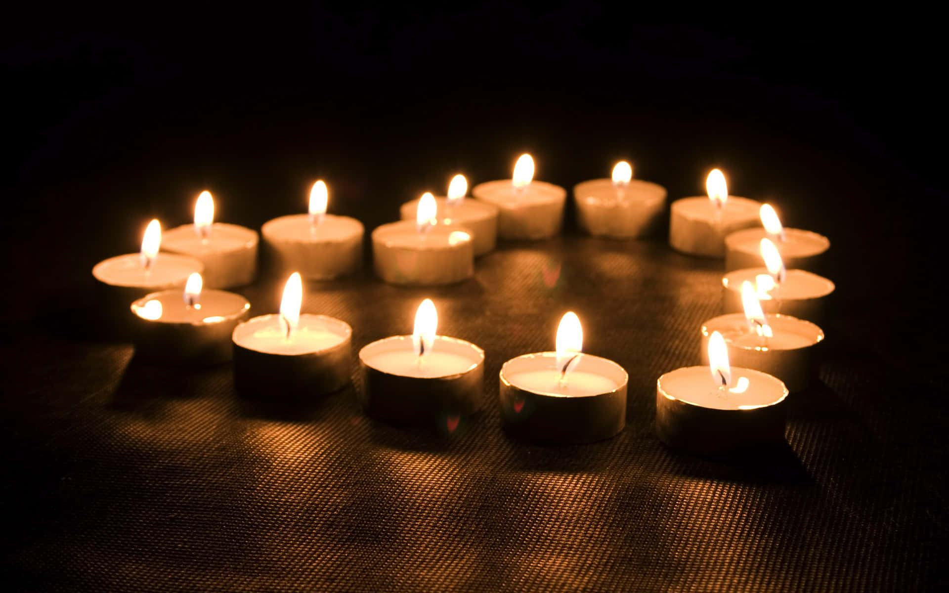 "The soft light of the flickering candle creates a still moment of peace."