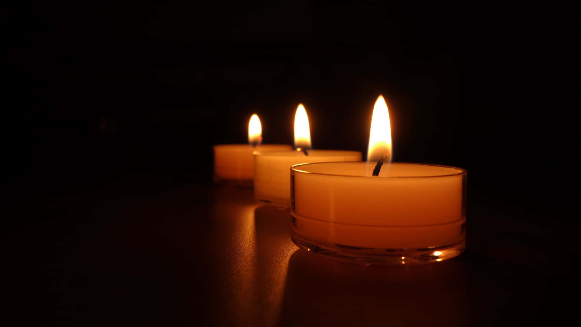 Illuminating the night with a candle flickering in the dark