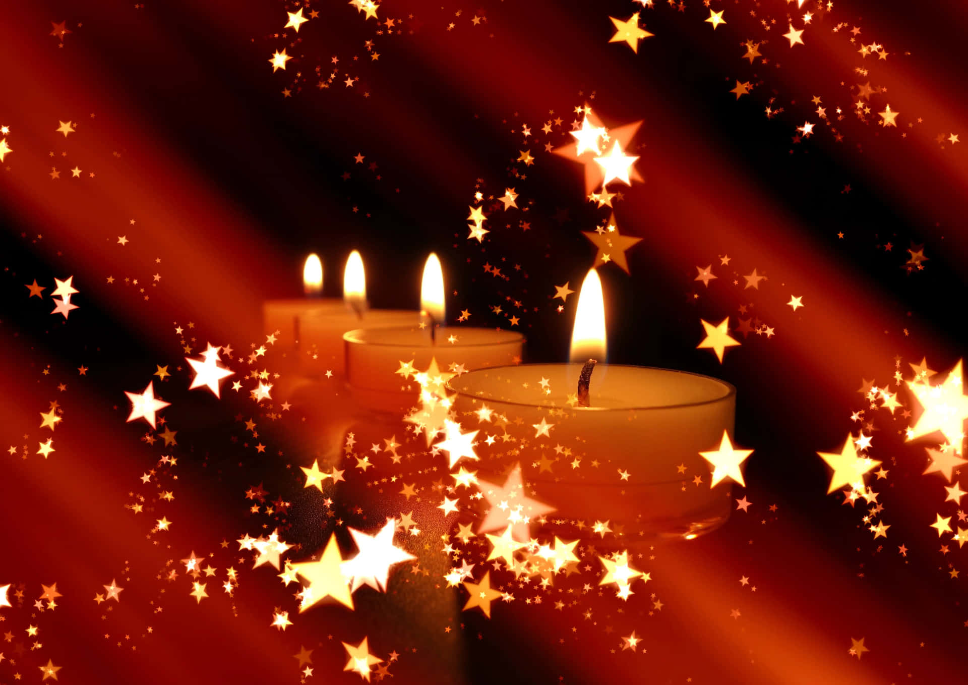 Three Candles With Stars On A Red Background
