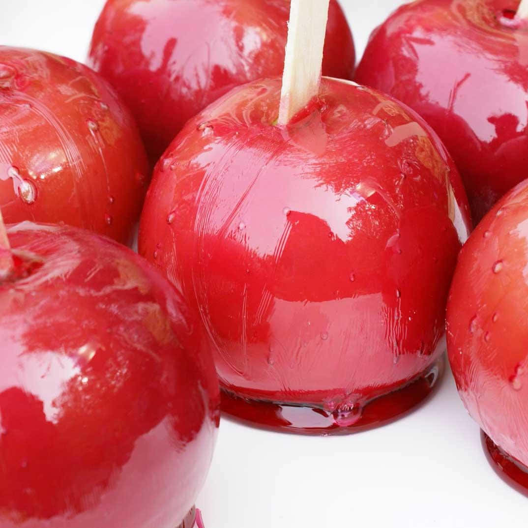 Delicious Candy Apples on Display Wallpaper
