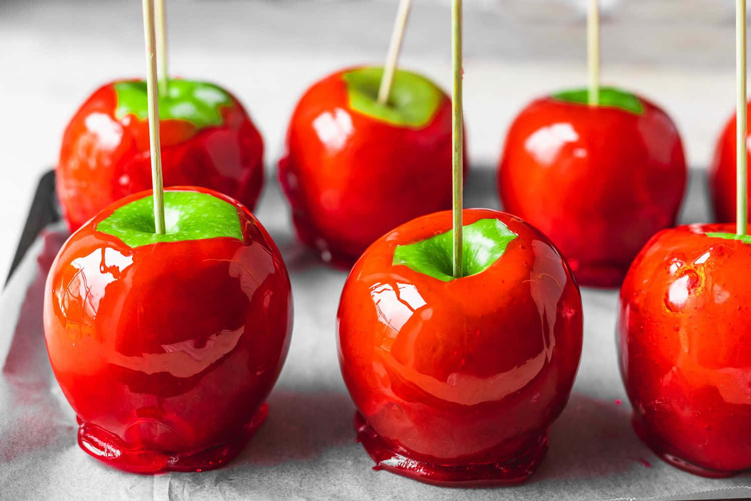 Delectable Red Candy Apples on Display Wallpaper