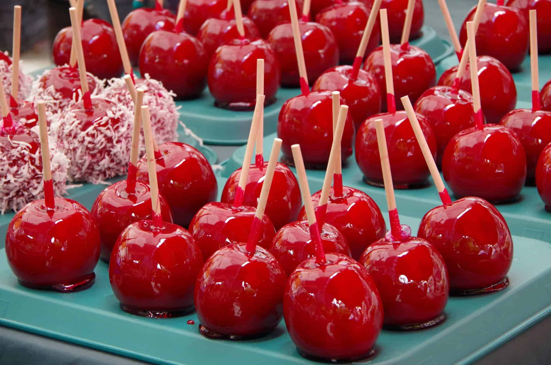 Vibrant Candy Apples On Display Wallpaper