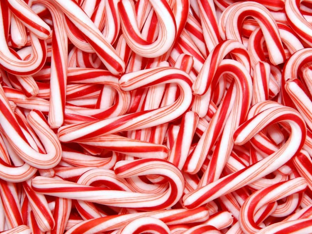 Colorful candy canes arrayed in crisscrossing patterns.