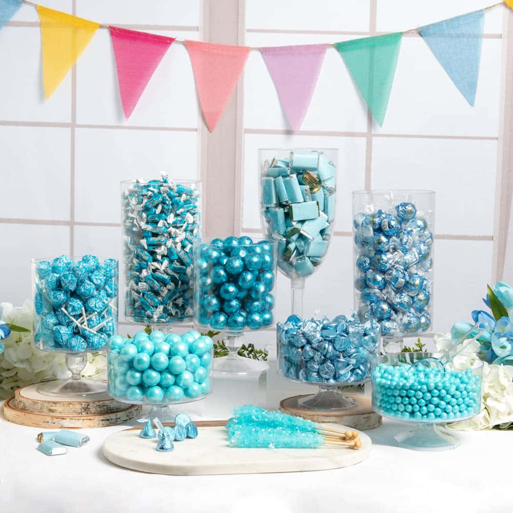 A Table With Blue Candy And Decorations