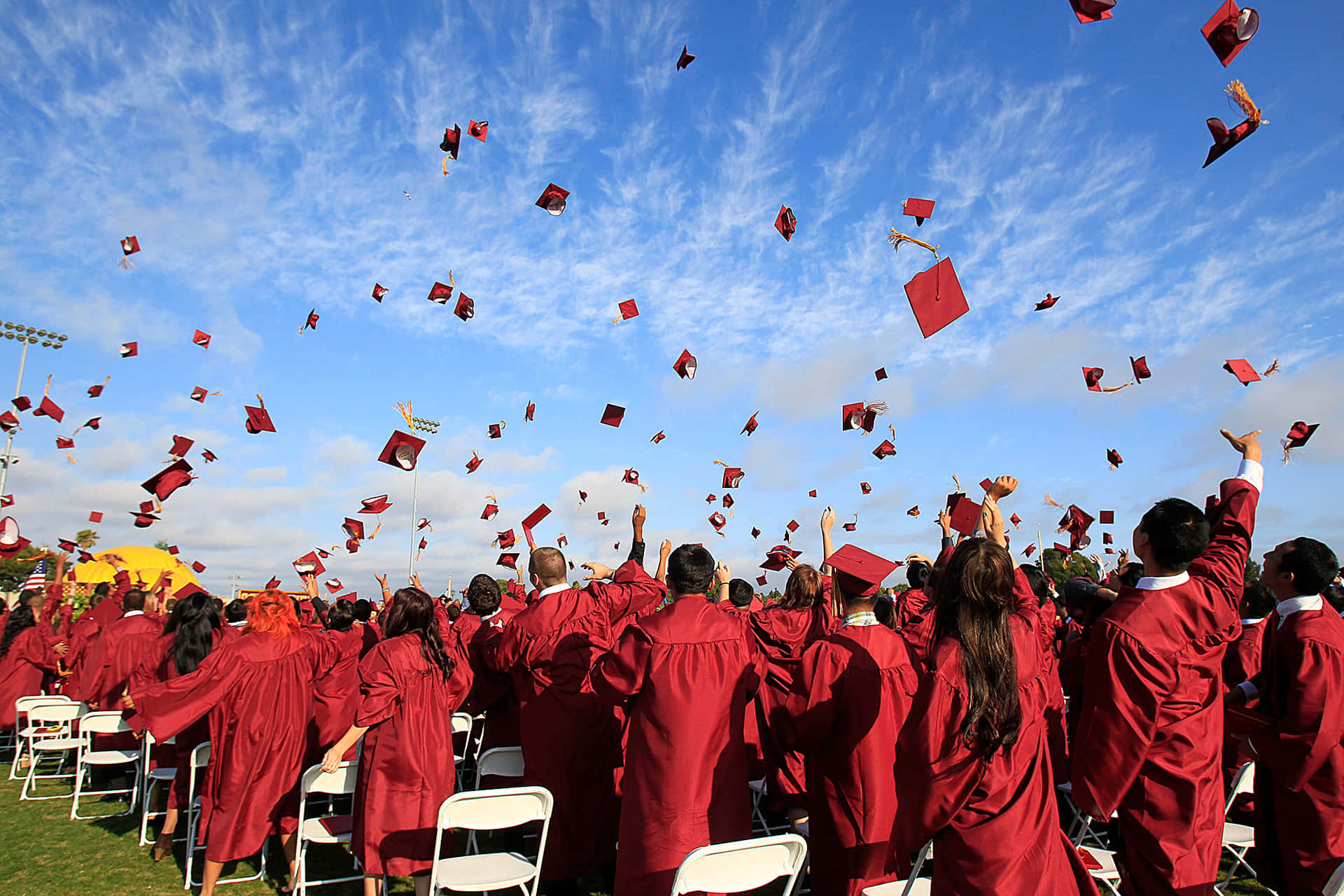 Red Graduation Cap And Gown Picture