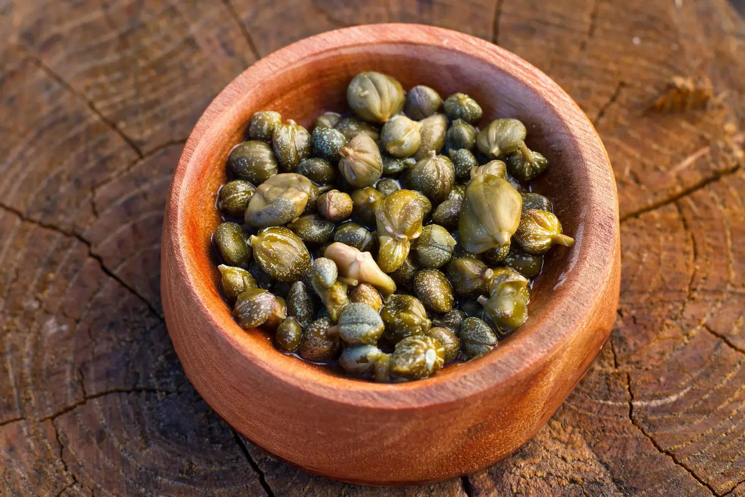 Capers In A Brown Clay Pot Wallpaper