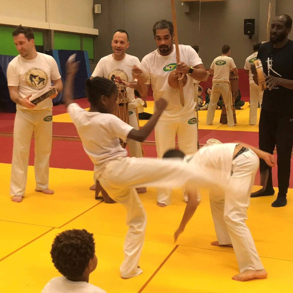 Children's Capoeira Class in Action Wallpaper