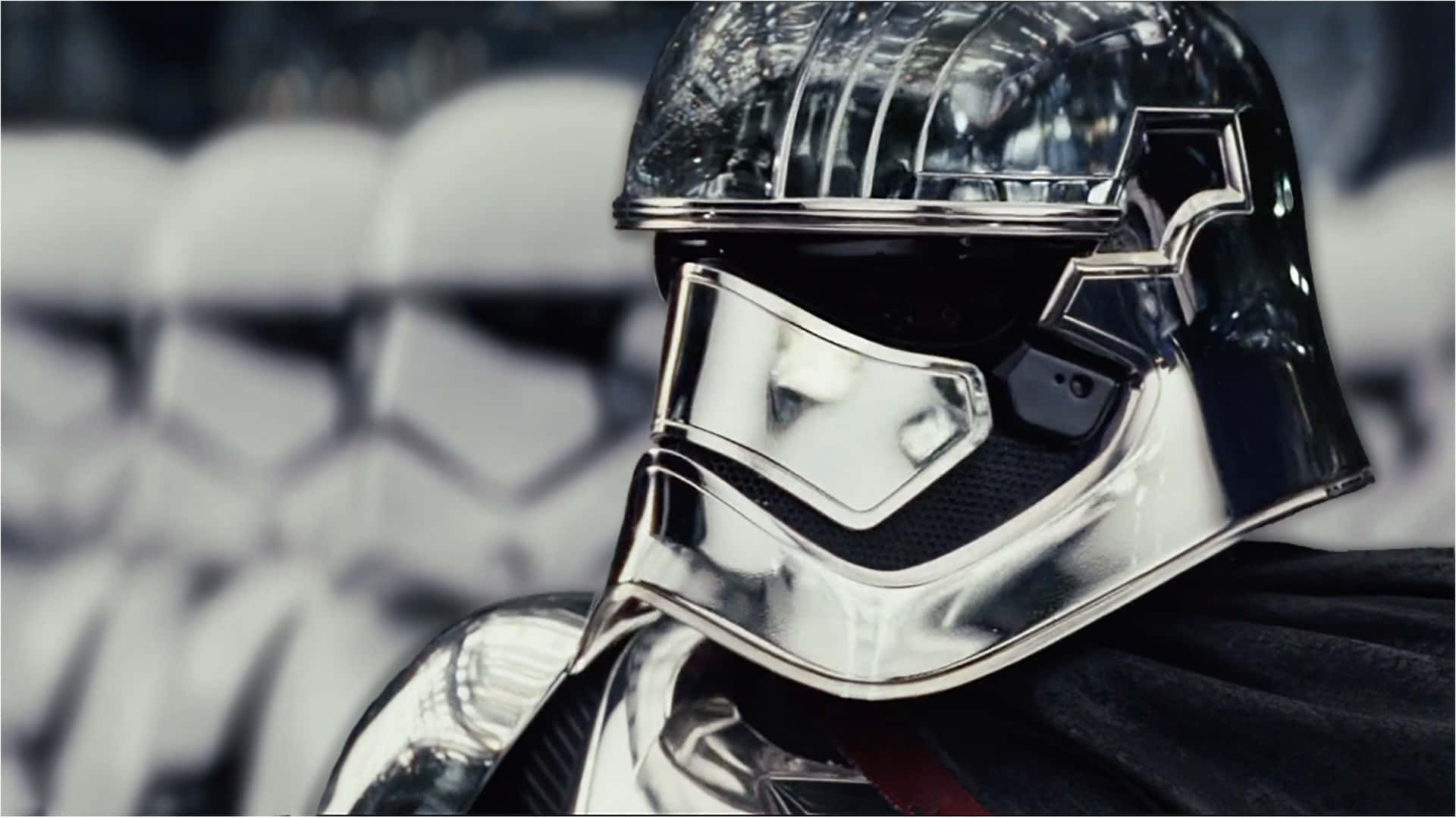 Captain Phasma Standing Tall in Armor with Blaster Wallpaper