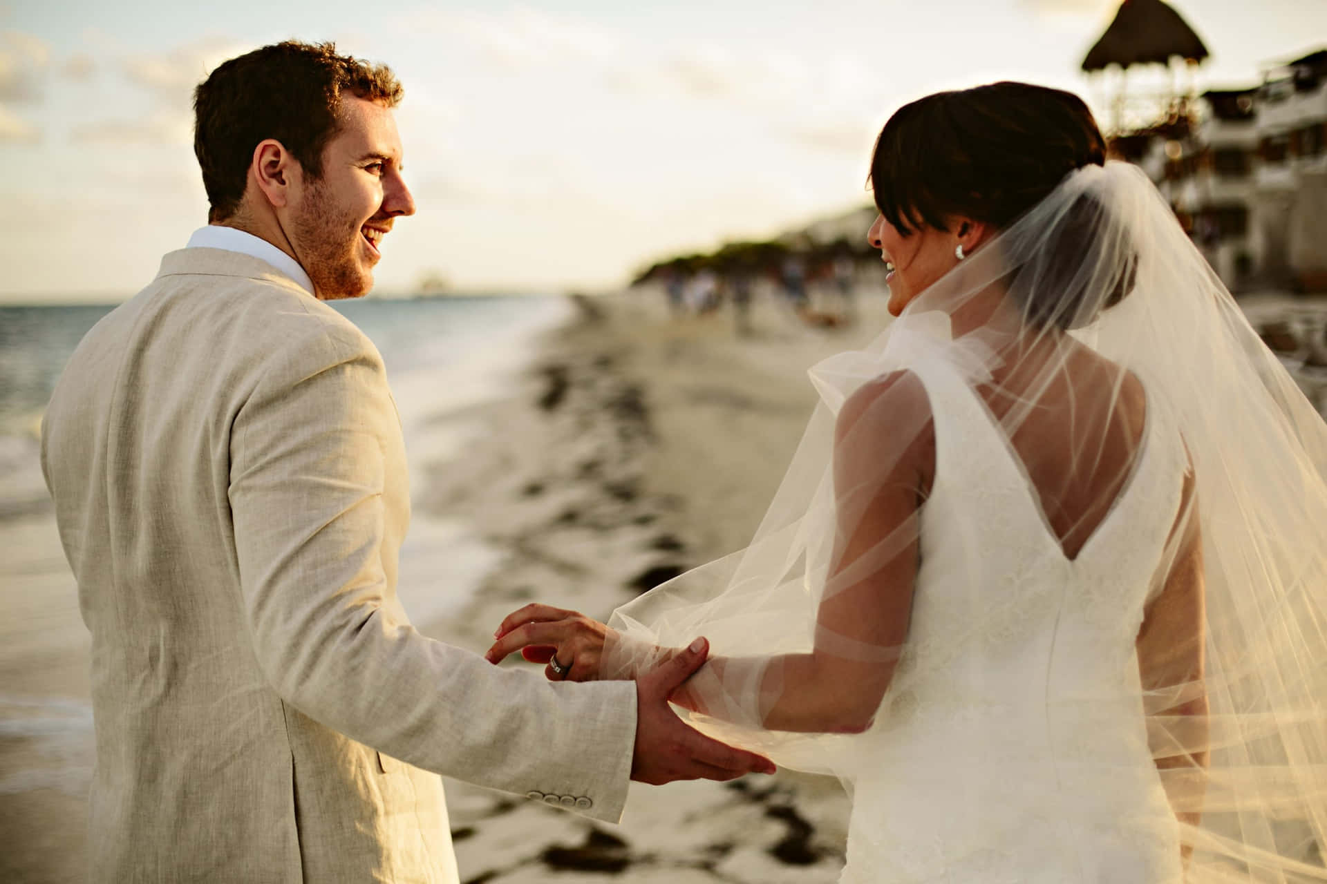 Caption: A Beautiful Moment Captured At A Beach Wedding Wallpaper