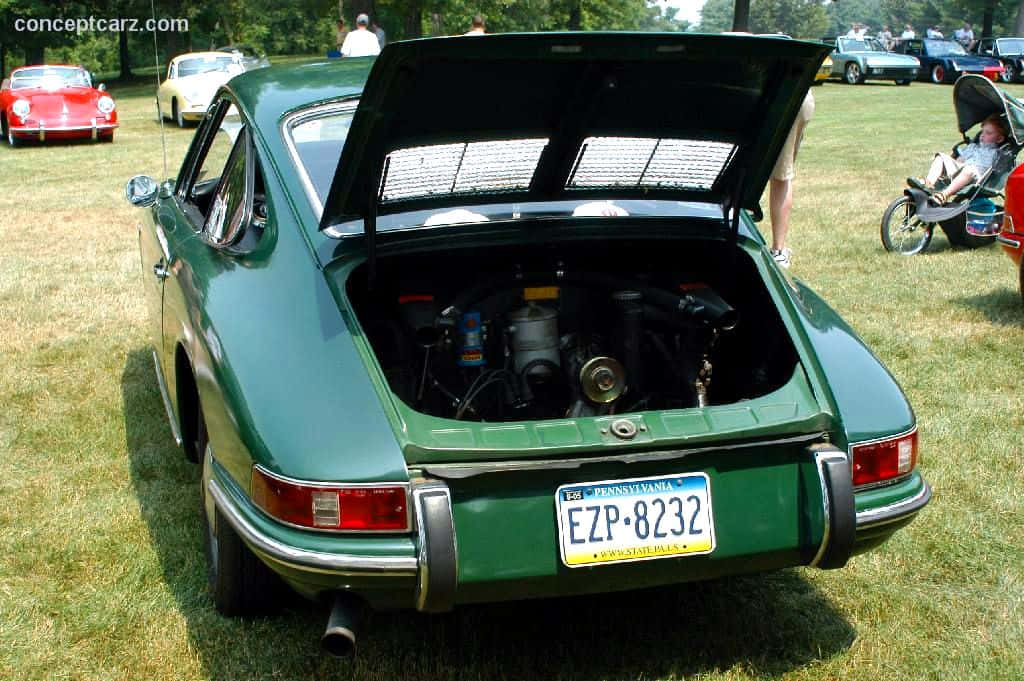 Caption: A Classic Porsche 912 Emerging From The Dark Wallpaper