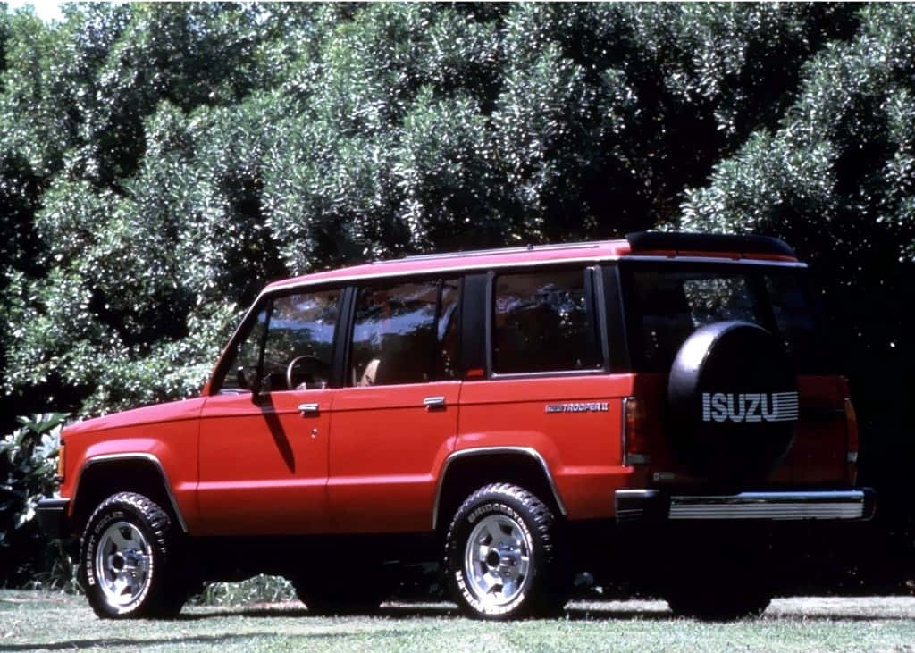 Caption: A Majestic Isuzu Trooper Showcases Its Rugged Elegance In An Off-road Setting. Wallpaper