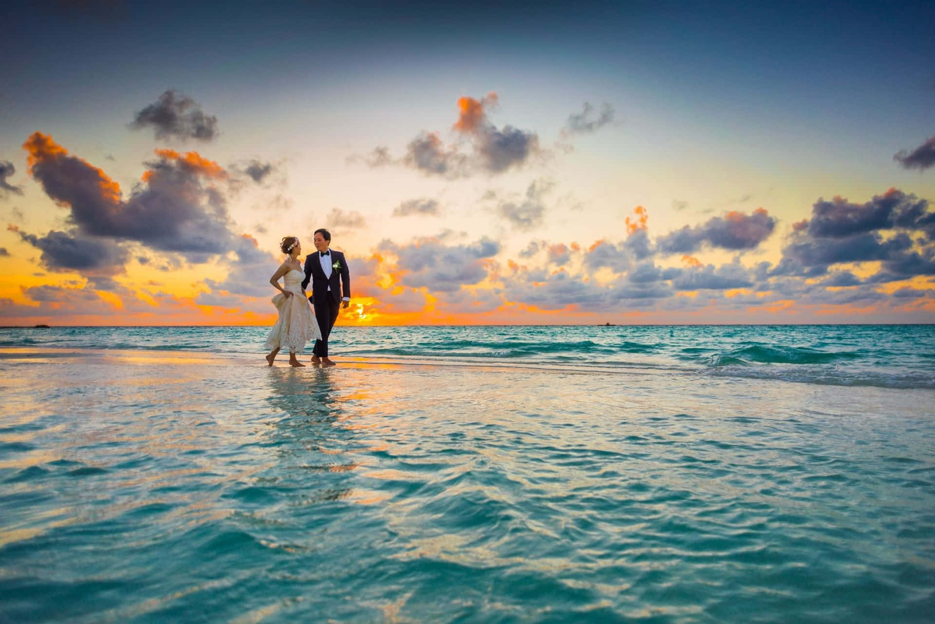 Caption: A Romantic Sunset Beach Wedding Wallpaper