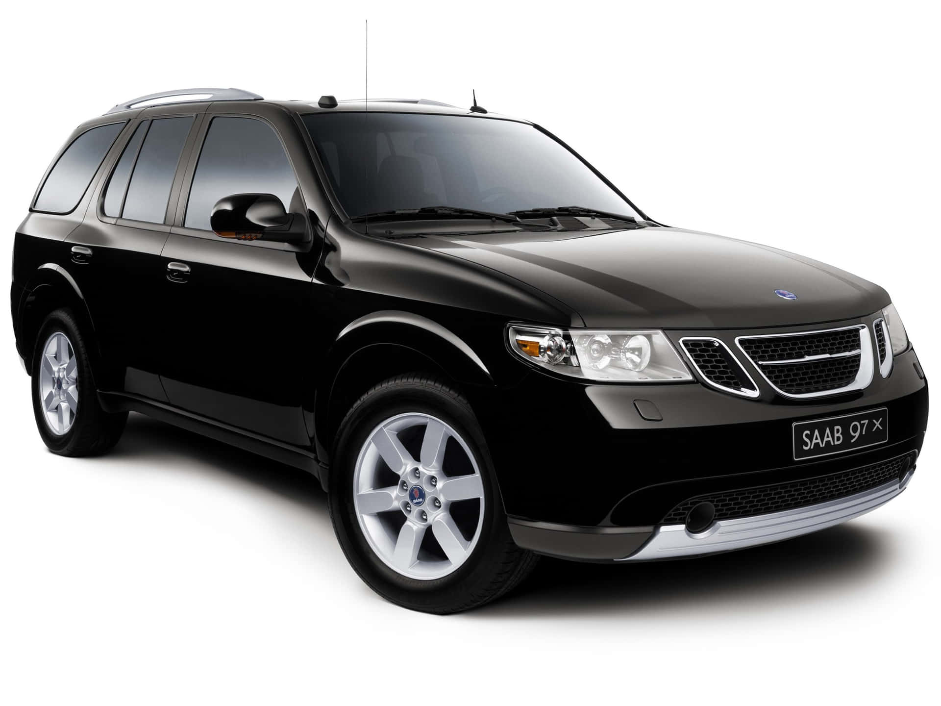 Caption: A Sleek, Powerful Saab 9-7x Parked In An Urban Environment. Wallpaper