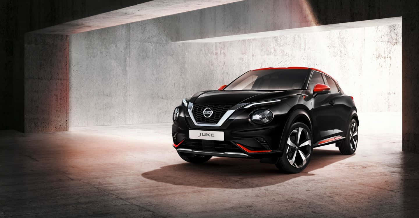 Caption: A Stunning Nissan Juke Against A Scenic Background Wallpaper