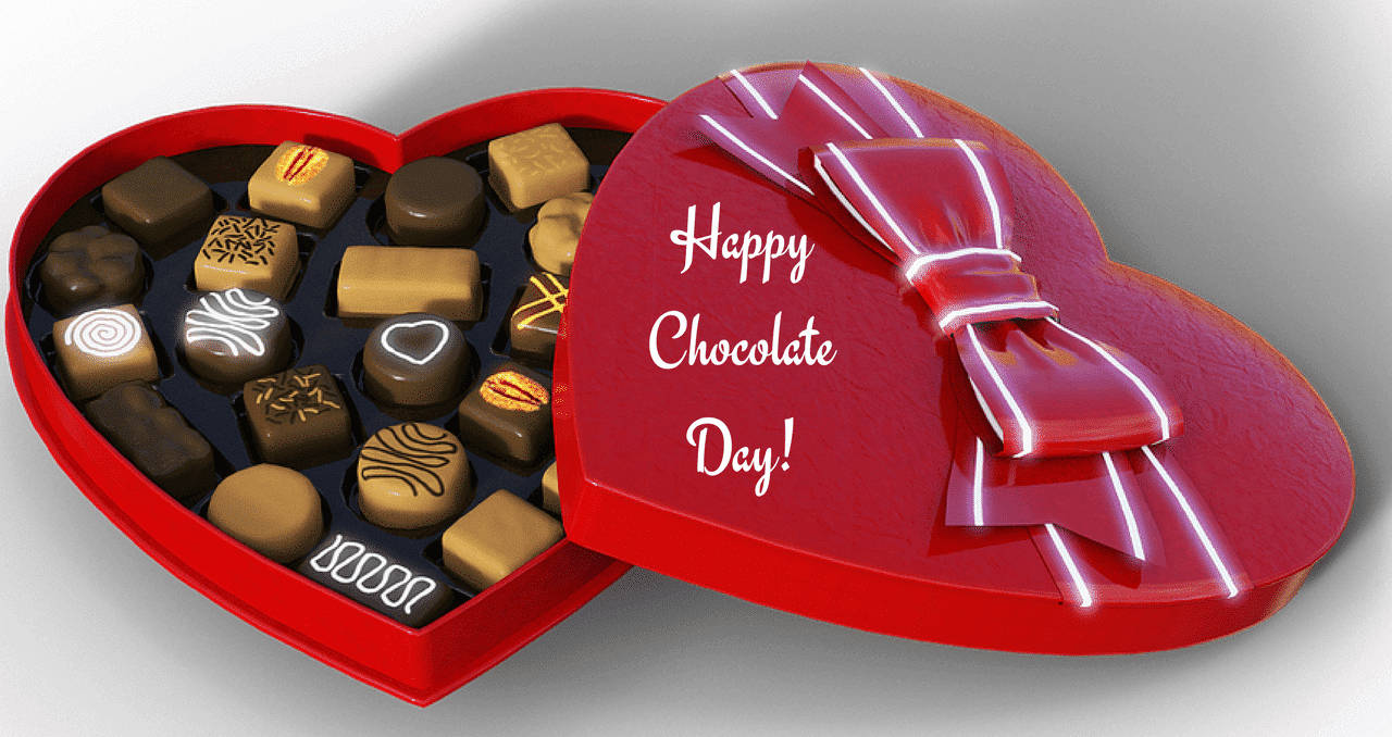 Caption: A Tempting Collection Of Assorted Chocolates On Chocolate Day Wallpaper