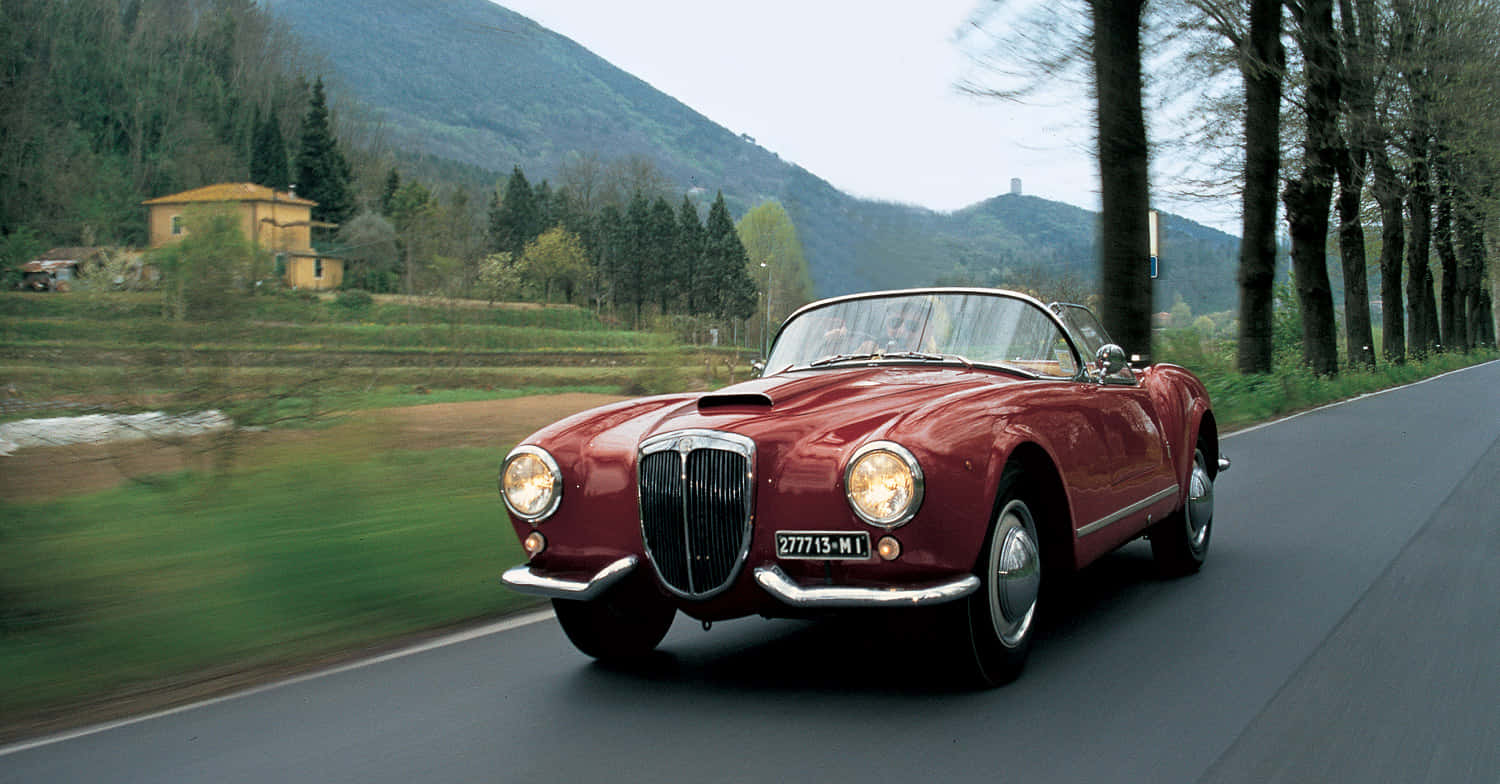 Caption: Aesthetic View Of Vintage Lancia Aurelia In Black And White Wallpaper