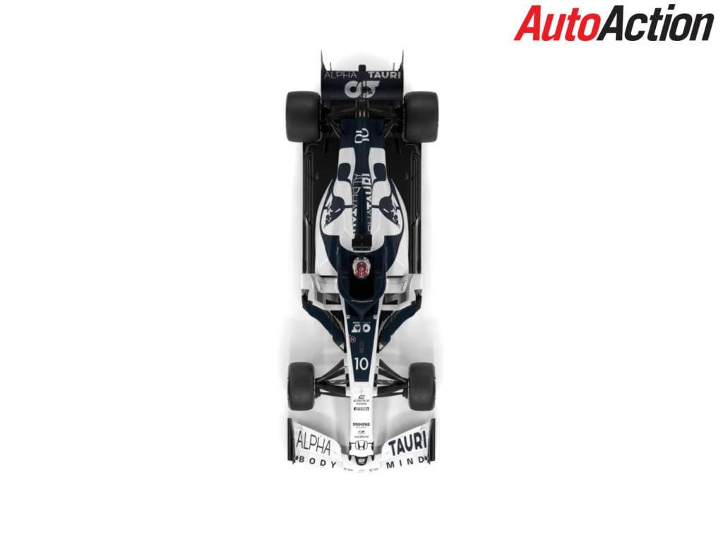 Caption: Alphatauri F1 Team In Action Wallpaper