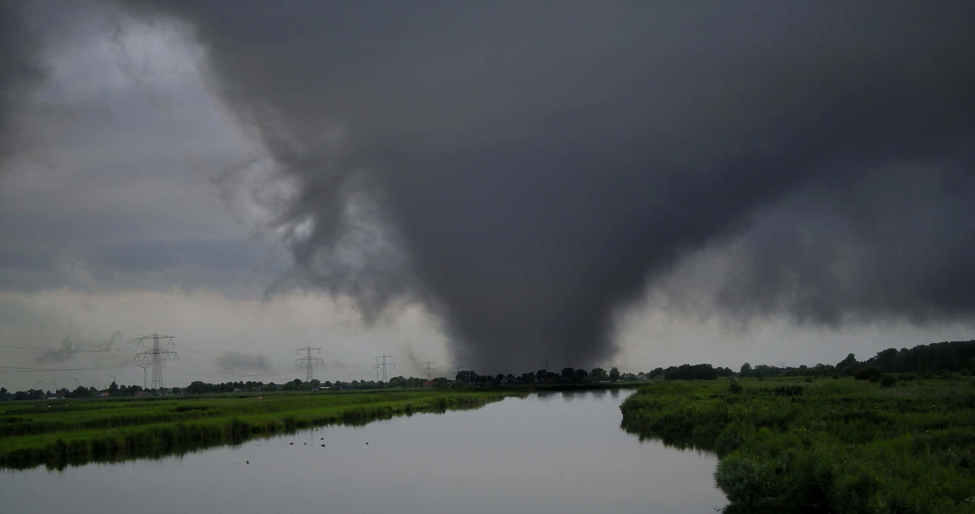 Caption: An Intense Tornado Sweeping Across The Open Field