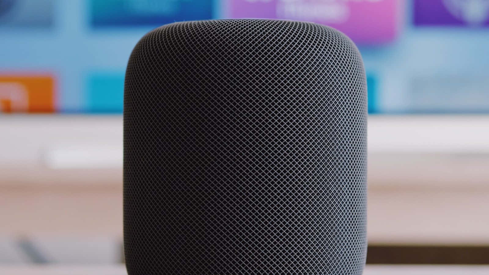 Caption: Apple Homepod On A Wooden Table Wallpaper