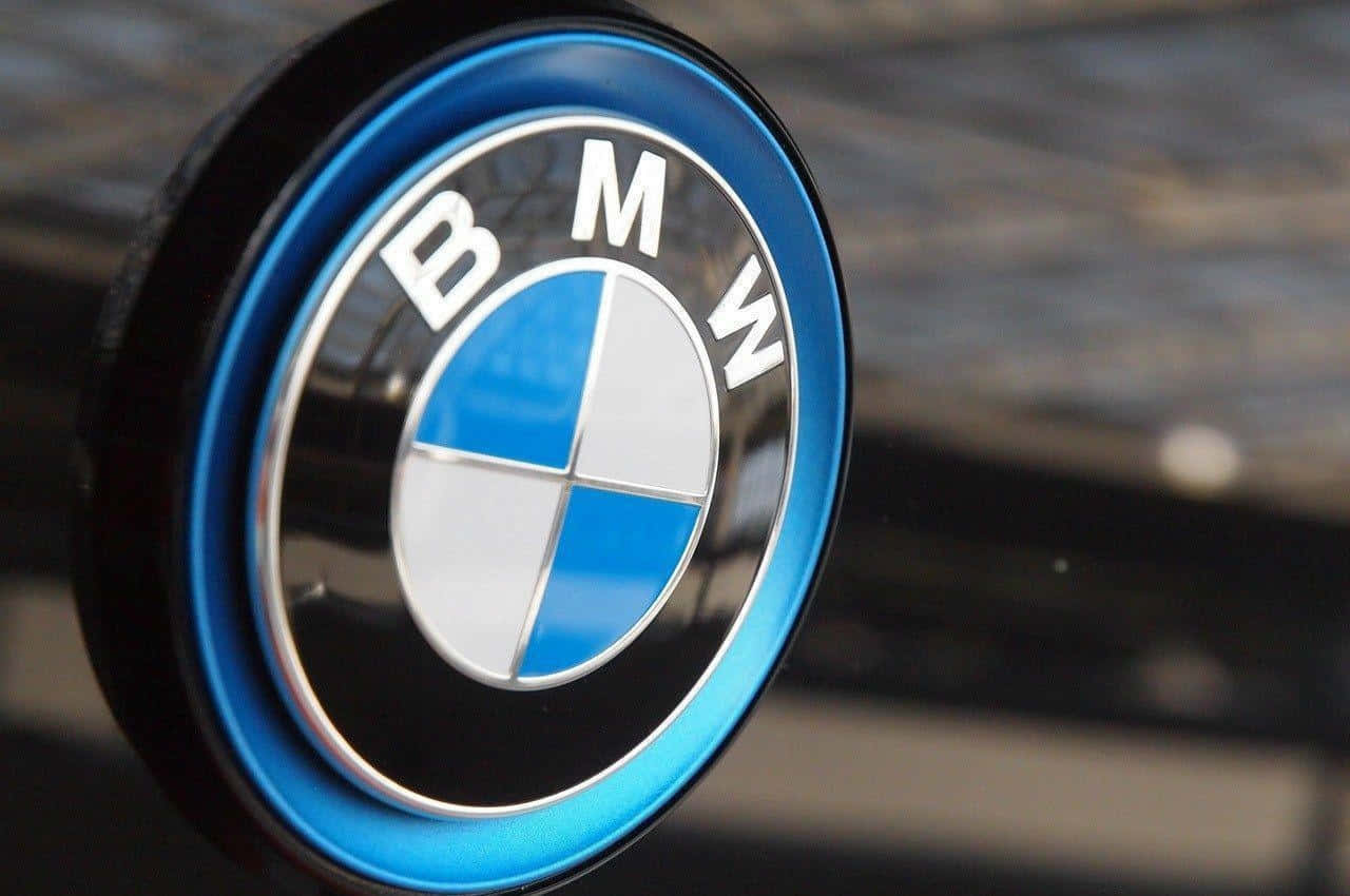 Caption: Bmw Logo On A Spotlighted Backdrop Wallpaper