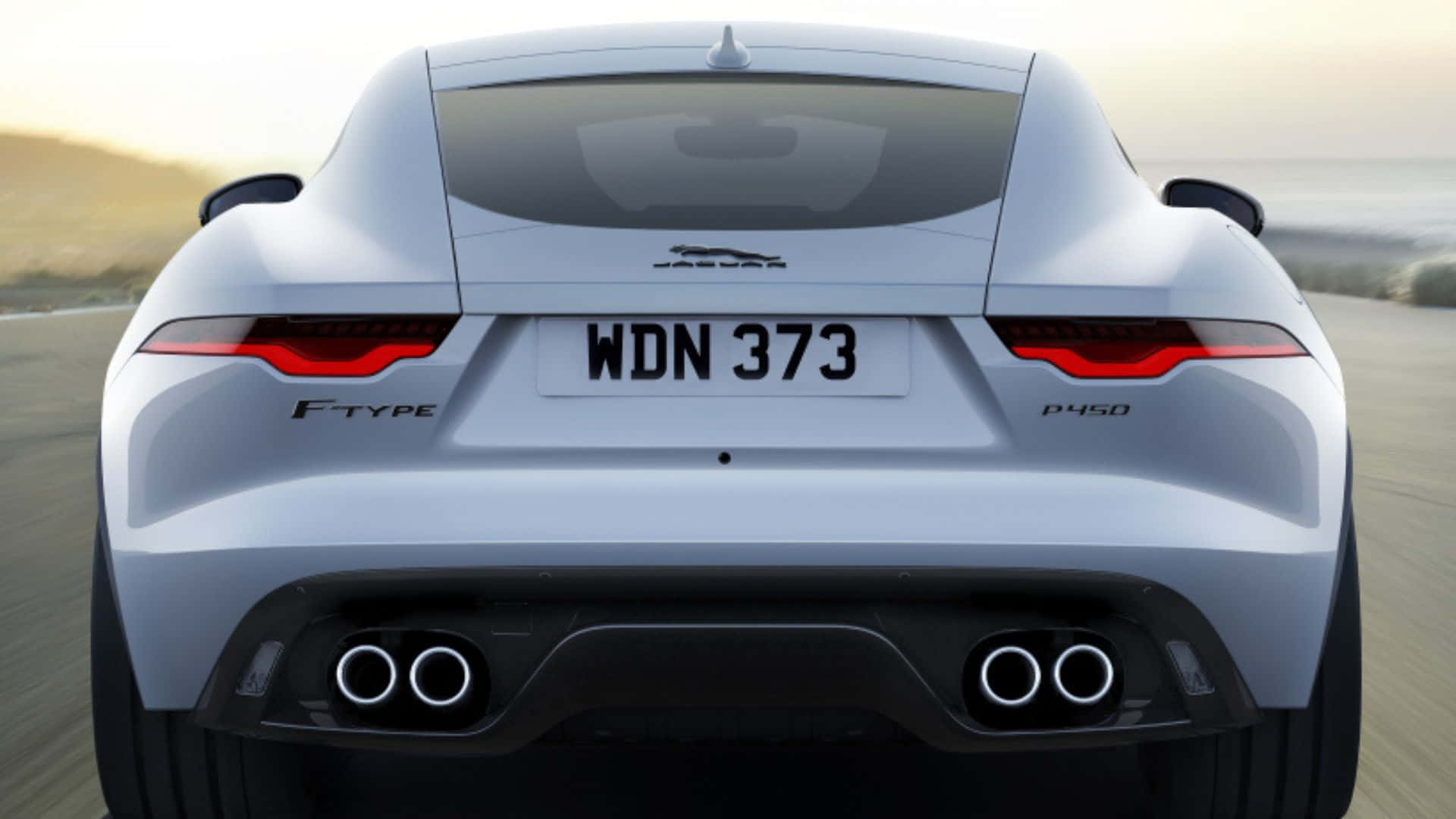 Caption: Bold Luxury Redefined In Motion - The Red Jaguar F-type Wallpaper