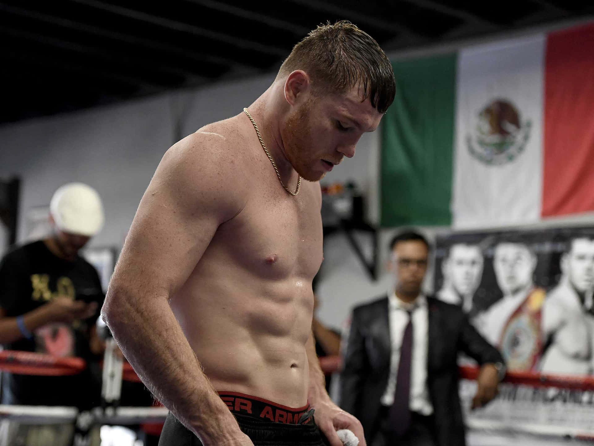 Caption: Boxing Champion Saul Canelo Alvarez Showering Strength And Power Wallpaper