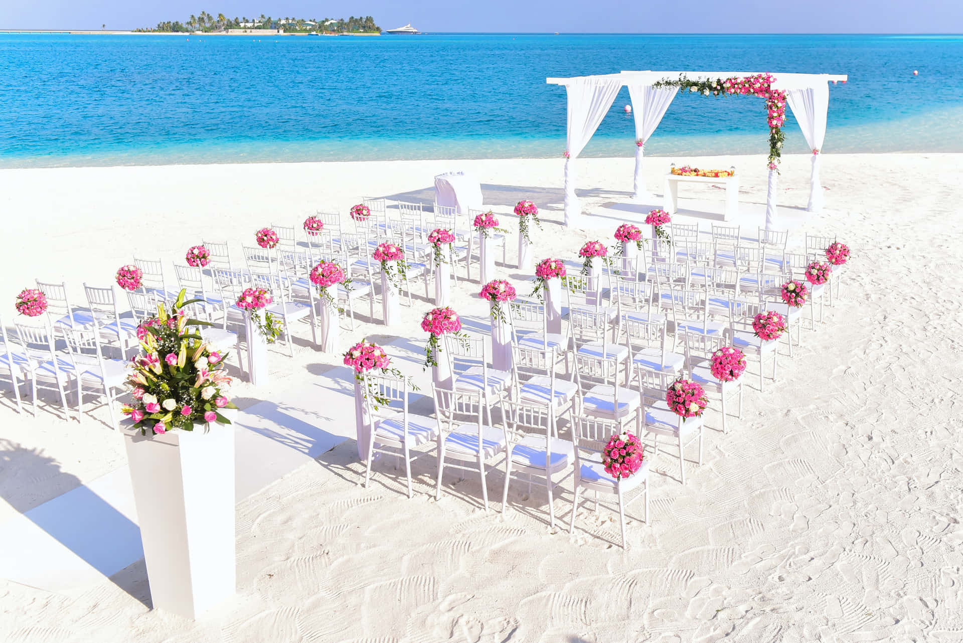 Caption: Breathtaking Beach Wedding Moment Wallpaper