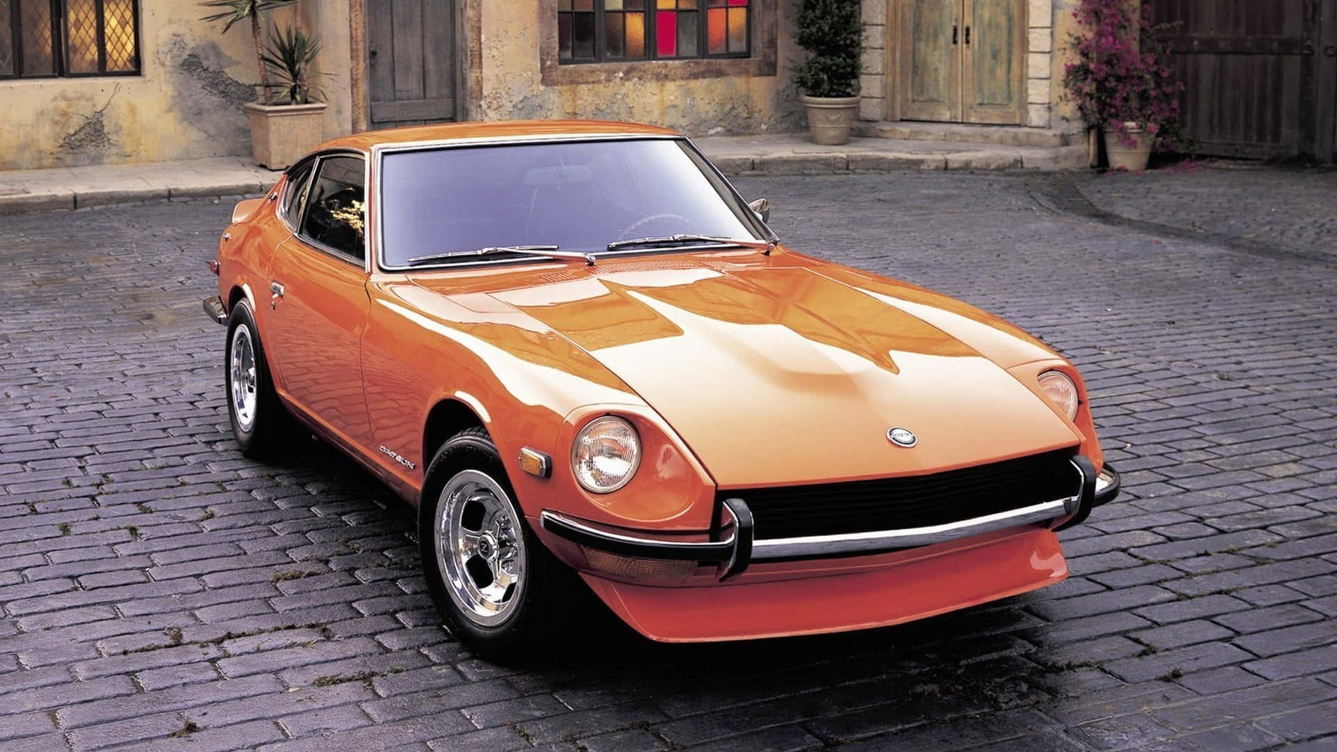 Caption: Classic Datsun 240z On Display Wallpaper