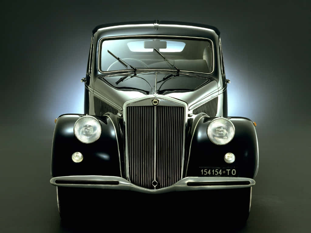 Caption: Classic Elegance: Vintage Lancia Aprilia Car Wallpaper