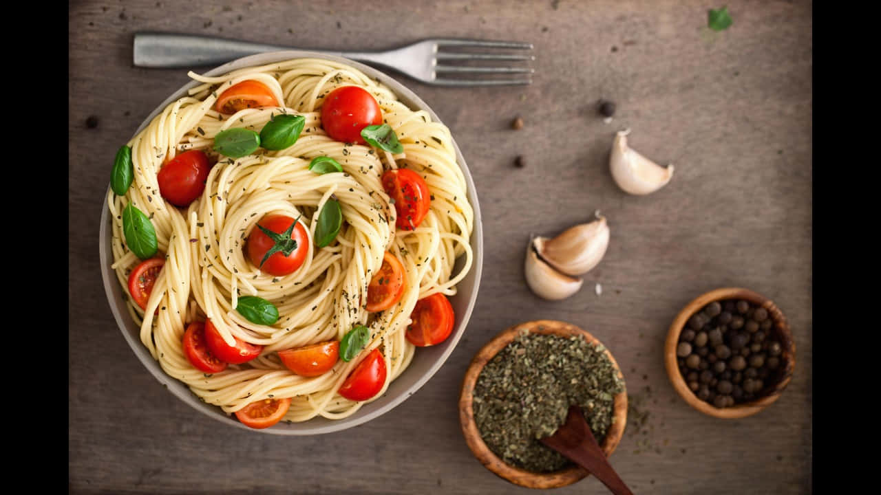 Caption: Classic Italian Cuisine - A Close-up View Of Delicious Pasta
