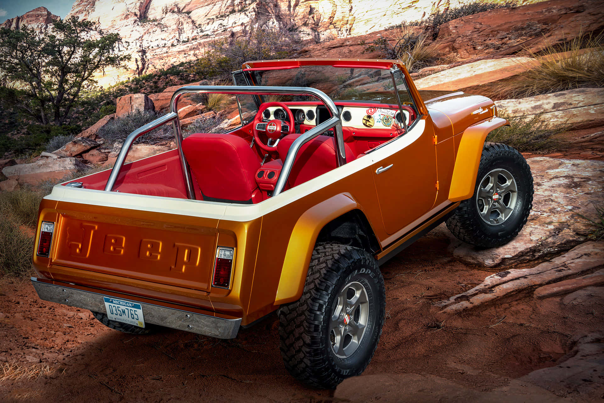 Caption: Classic Jeepster Cruising On A Bumpy Trail Wallpaper