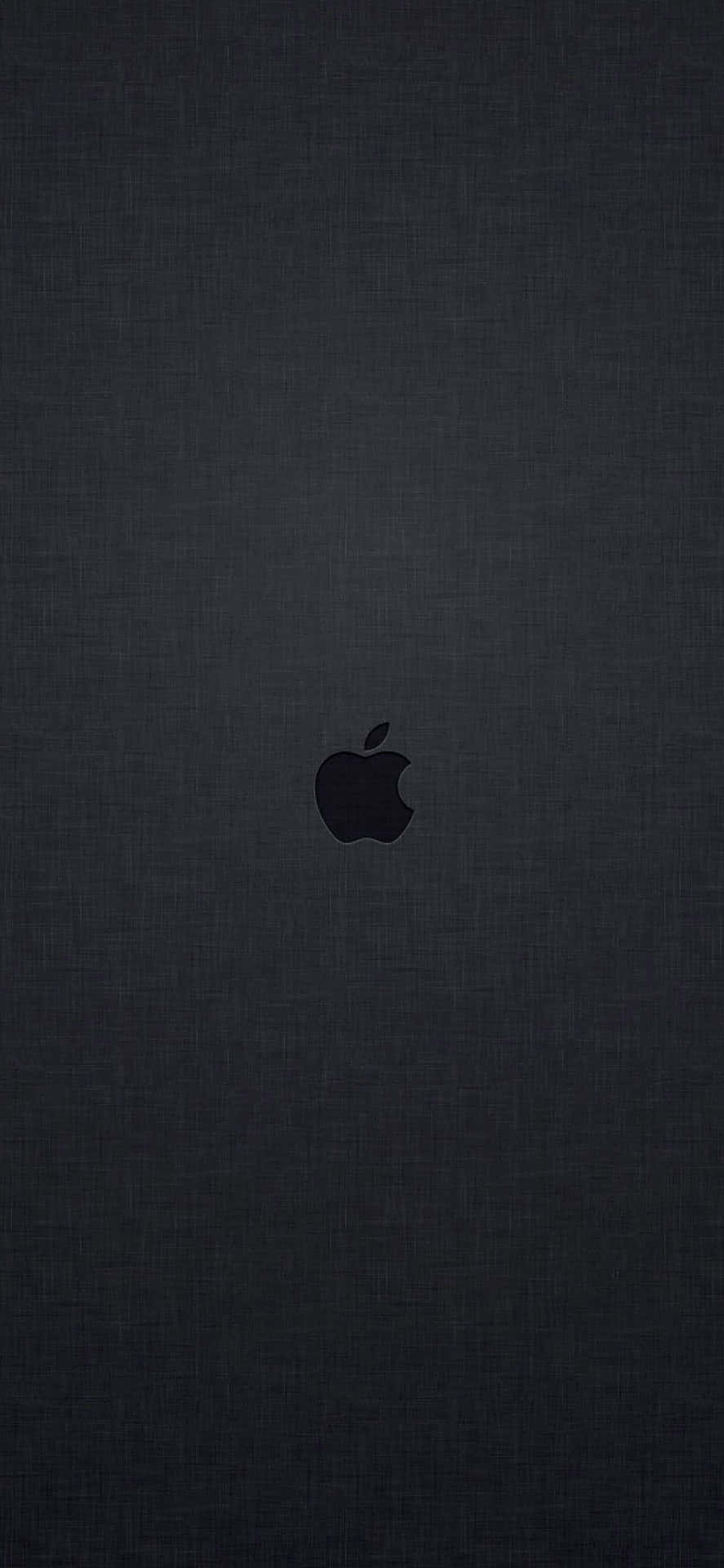 Caption: Close-up Shot Of Silver Apple Inc. Logo On Dark Background