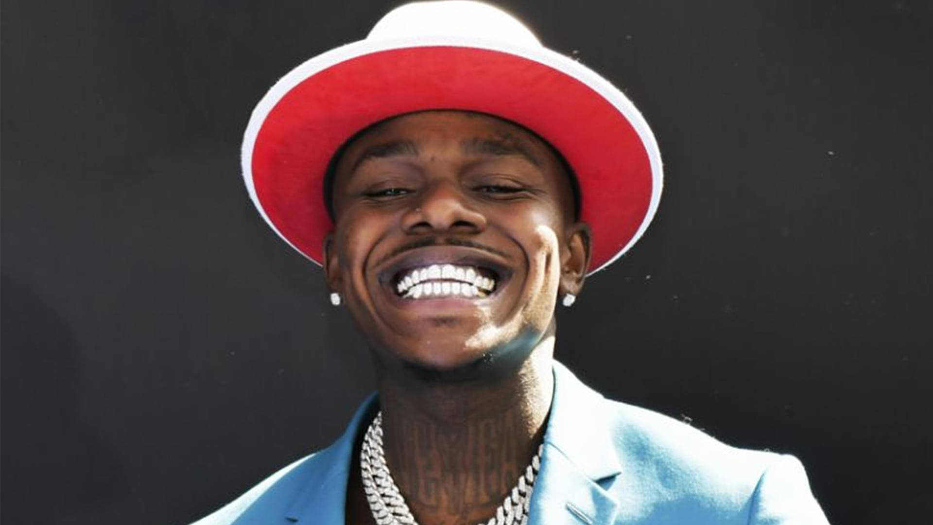 Caption: Dababy In Action - Dynamic Stage Performance Wallpaper