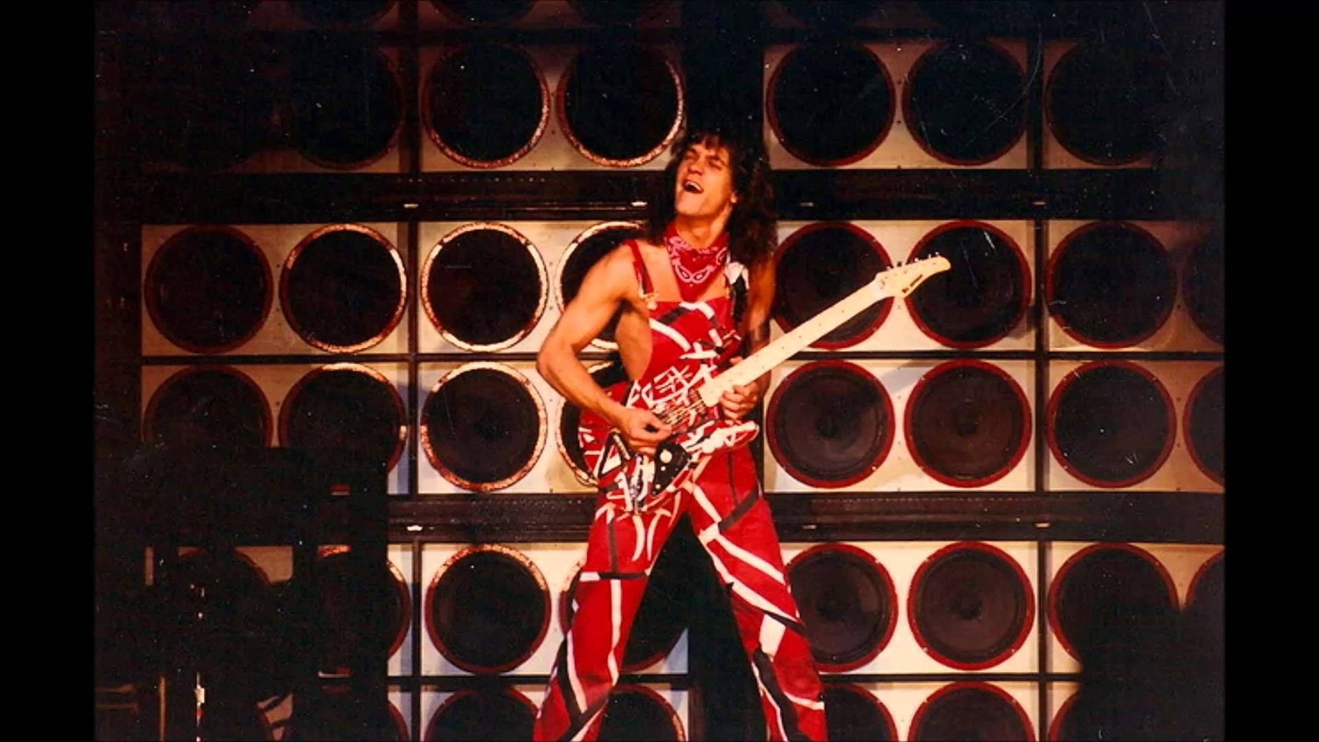 Caption: Eddie Van Halen Rocking On Stage Wallpaper
