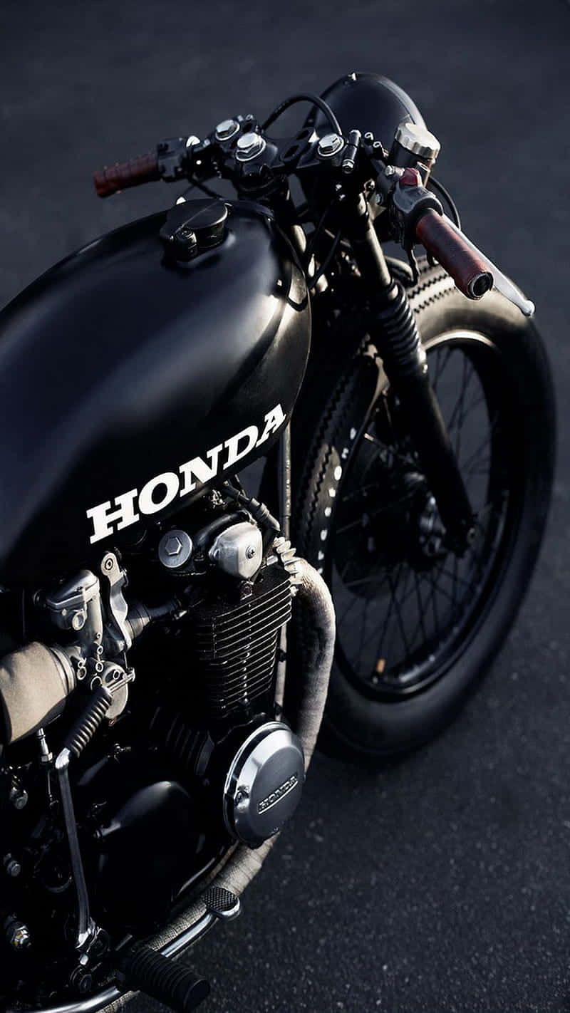 Caption: "effortless Speed - The Majestic Honda Motorcycle In Action" Wallpaper