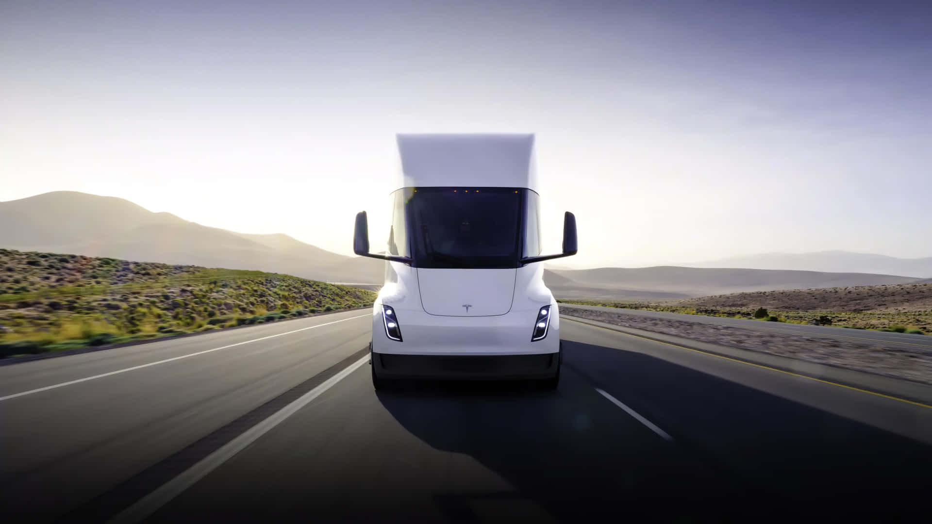 Caption: Electric Innovation: Tesla Semi Truck In Motion Wallpaper