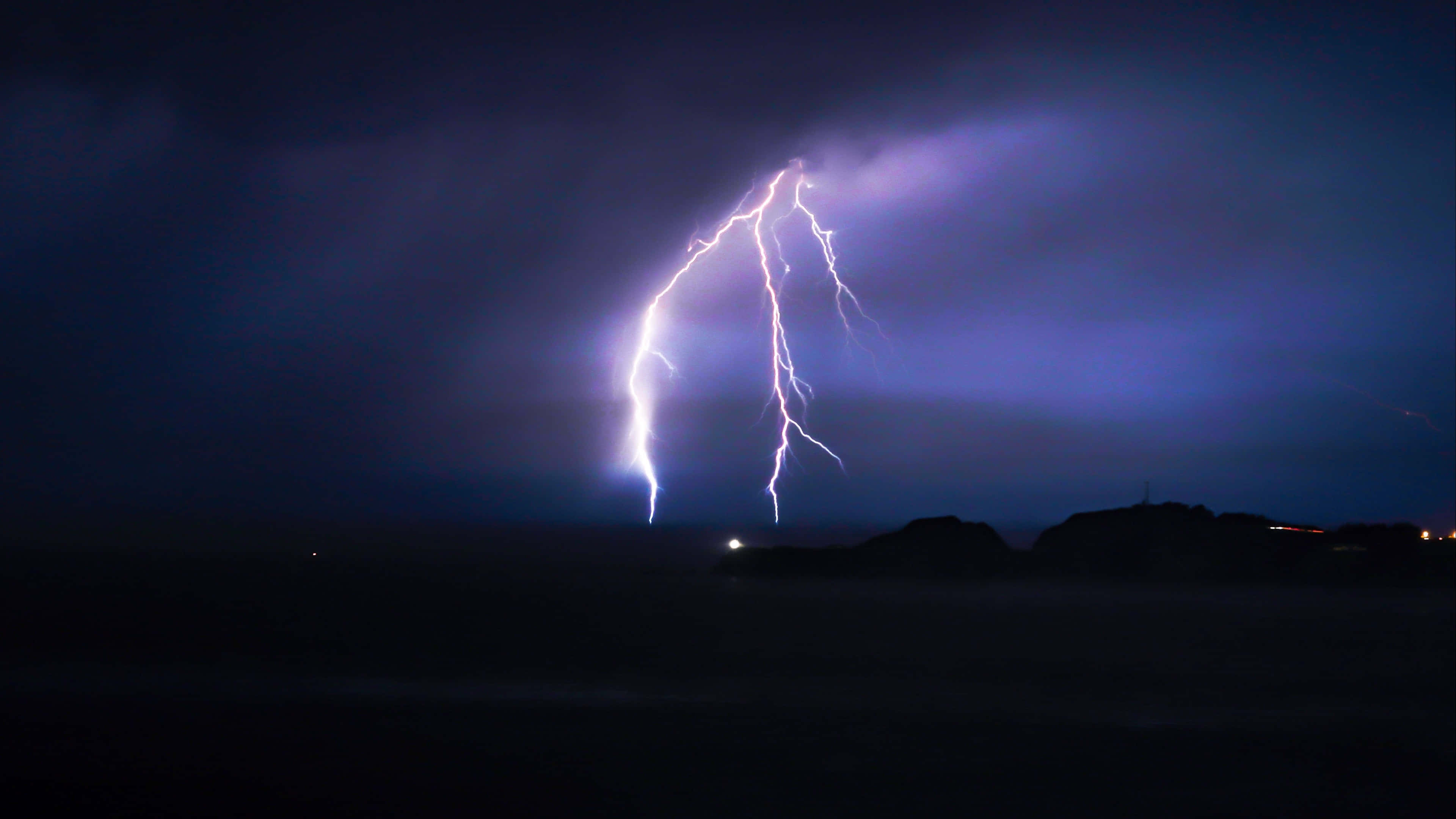 Caption: Electrifying 4k Lightning Storm Wallpaper
