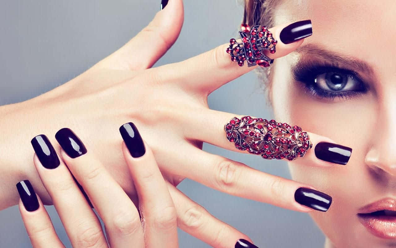 Caption: Elegant Hand With Crushed Shell Nail Design Wallpaper